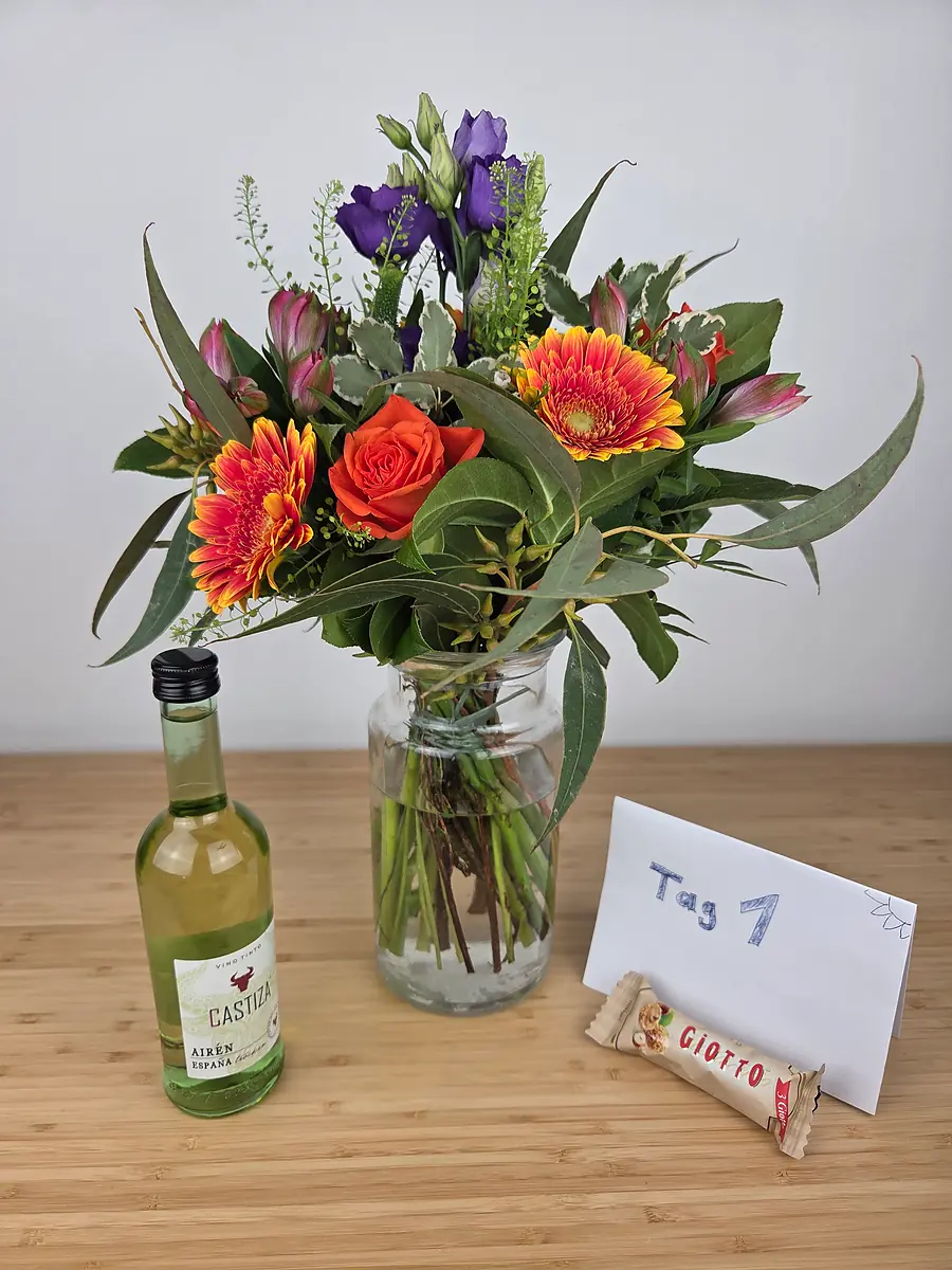 Bluvesa Strauß Happy Birthday am Anliefertag mit den beiden Gratisbeigaben: 0,2-l-Weißwein und Giotto-Schokolade